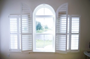 Open white arched plantation custom interior shutters Millville DE