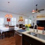 A kitchen and dining room view of white custom interior shutters Millville DE