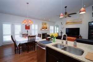 A kitchen and dining room view of white custom interior shutters Millville DE