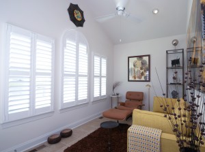 White interior shutters in front of a living space Millville DE