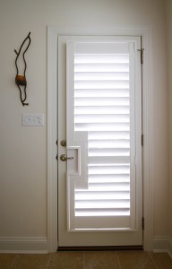 Door with window and custom shutters outside view