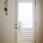 Door with window and custom shutters outside view