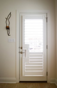 Door with window and custom shutters outside view