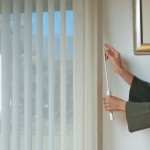 A person using their wandcord to open their custom curtains Millville DE
