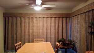 Dining room with table and vertical treatments
