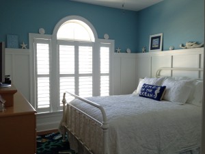 Blue beachy bedroom with custom shutters