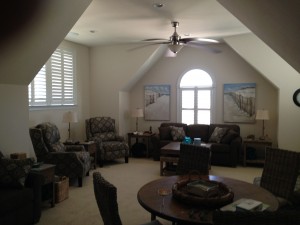 Interior shutters in a living room setting from A Shade Above Millville DE