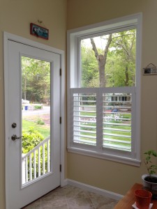 A door and a window with custom shutters