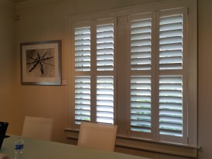 Interior view of custom shutters and wall picture